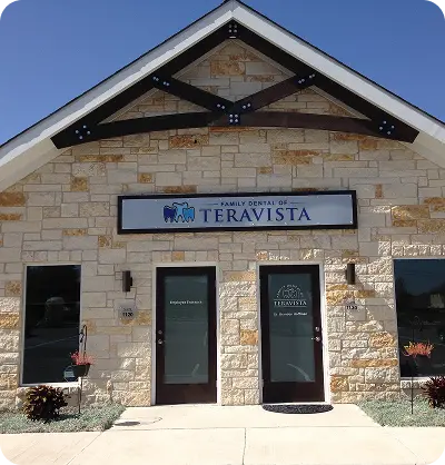 Exterior view of Family Dental of Teravista clinic featuring stone facade, logo signage, and welcoming entrance—reflecting professionalism, warmth, and neighborhood accessibility